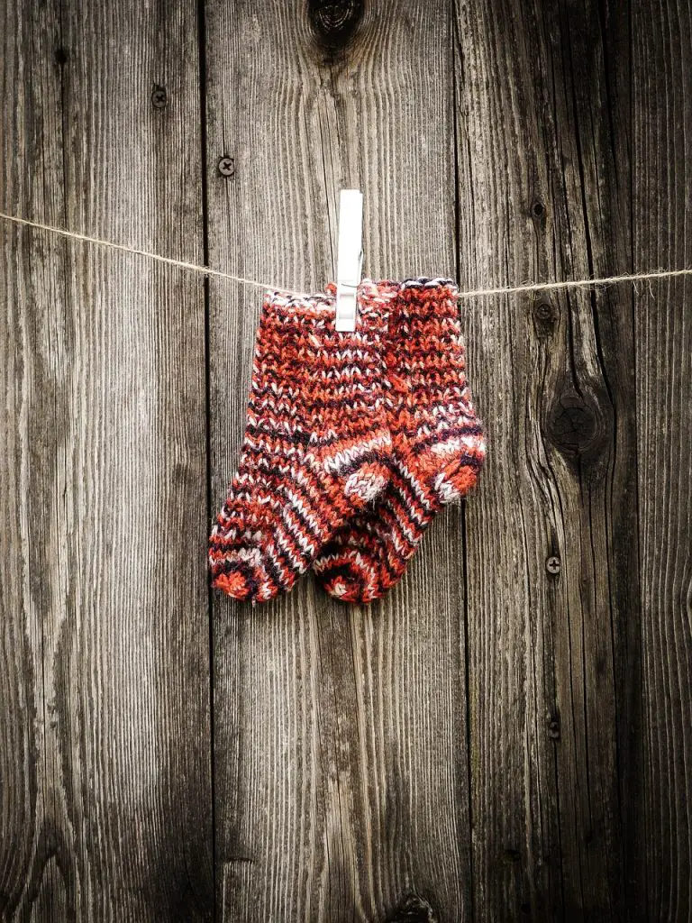 a pair of socks as an example of a small knitting project for kids