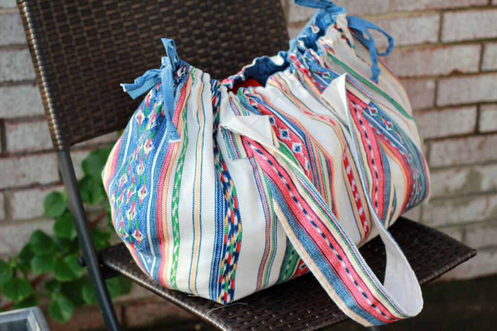 boho beach bag resting on chair