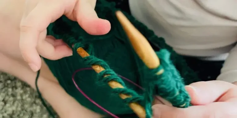 kid learning to knit